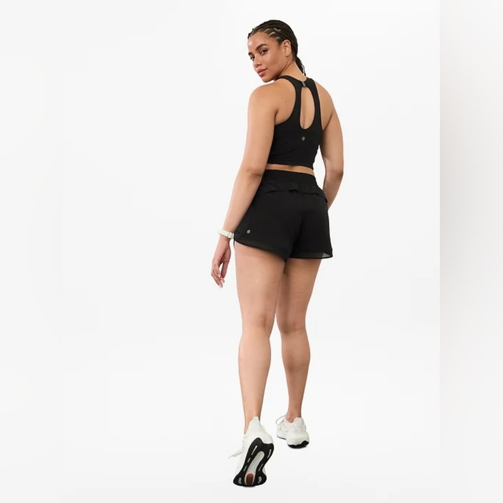 Athleta Mid Rise 4" Running Short W/
Targeted ventilation, hidden zip pocket,